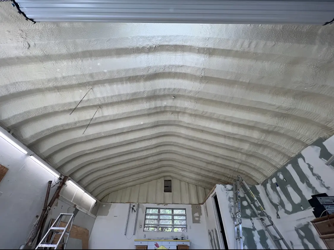 Spray polyurethane foam applied to the underside of a metal roof deck in East Marlborough